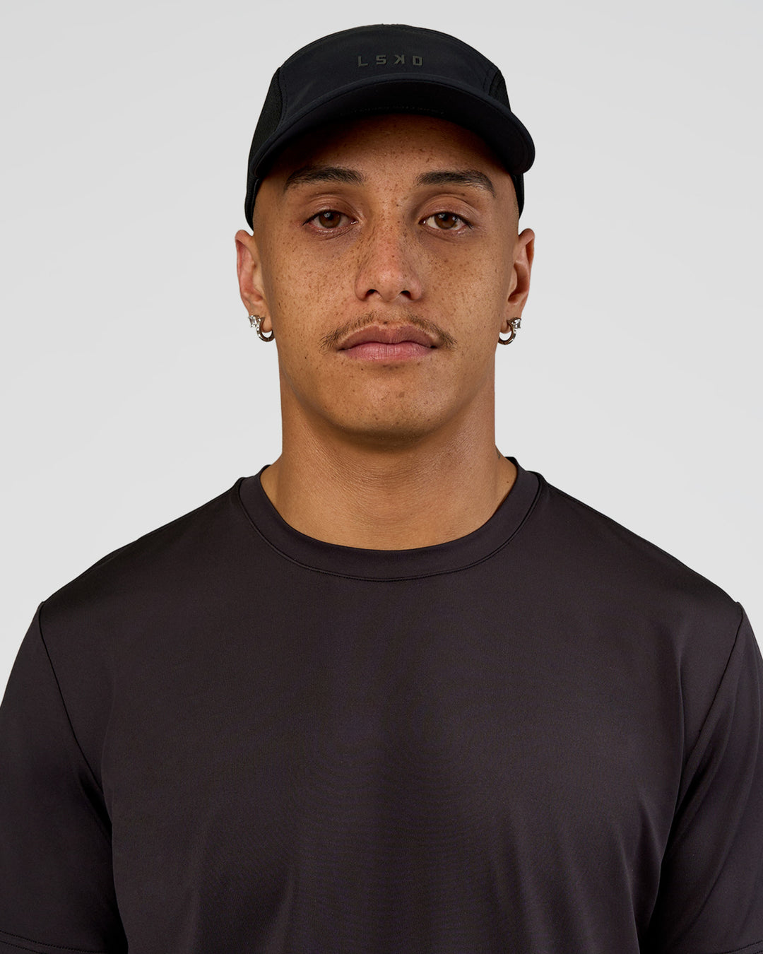 Man wearing Accelerate Cap - Black