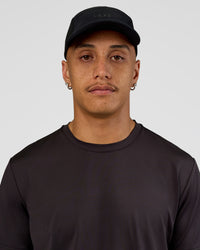 Man wearing Accelerate Cap - Black