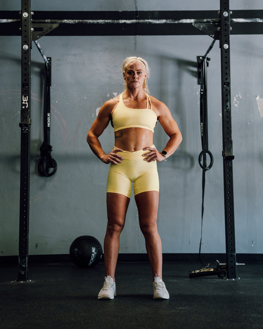 Woman wearing Sara Strike Ultra High-Rise Cross Over Waist 6&quot; Short - Sunflower