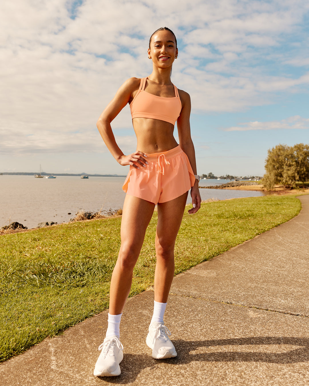 Woman wearing Accelerate 3&quot; Running Short - Cantaloupe | Model:  | Size: