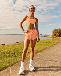 Woman wearing Accelerate 3" Running Short - Cantaloupe | Model:  | Size: