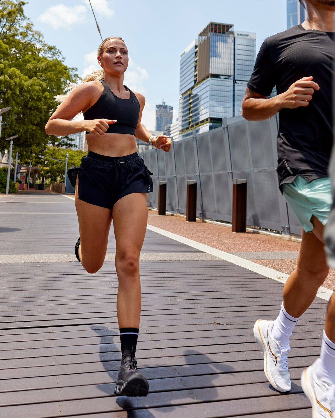 Woman wearing Accelerate Run Shorts - Black