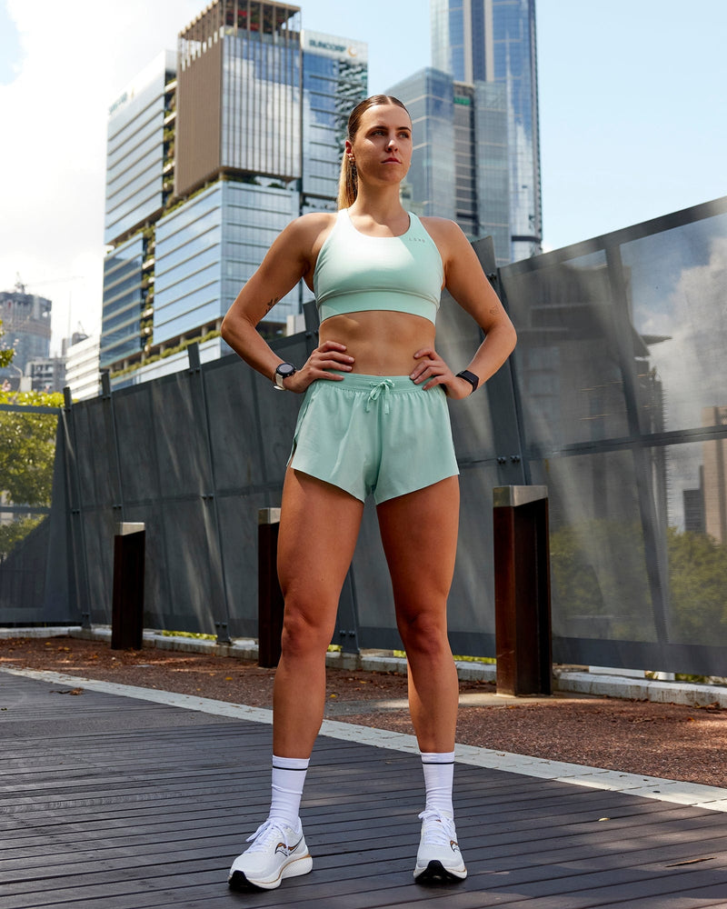 Woman wearing Accelerate Run Shorts - Pastel Turquoise