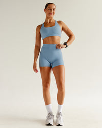 Woman wearing Aspire Sports Bra - Glacier Lake