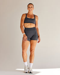 Woman wearing Bree Masters Velocity Sports Bra - Stormy