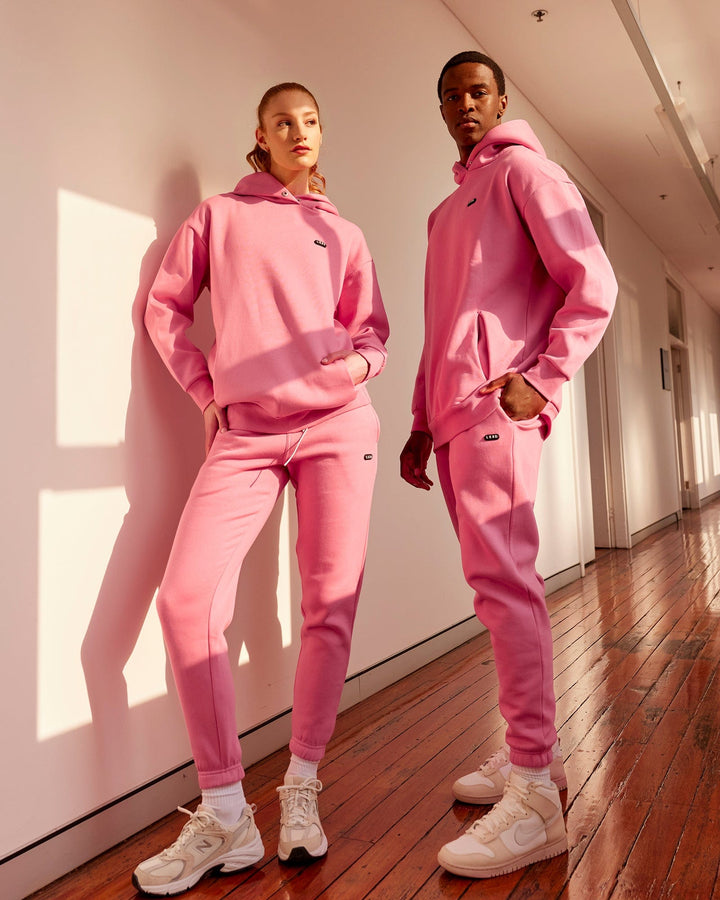 Man wearing Unisex Capsule Hoodie Oversize - Pink Rose