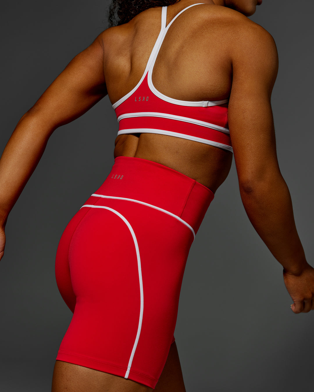 Woman wearing Contrast Ultra High-Rise 6&quot; Short - Scarlet-White