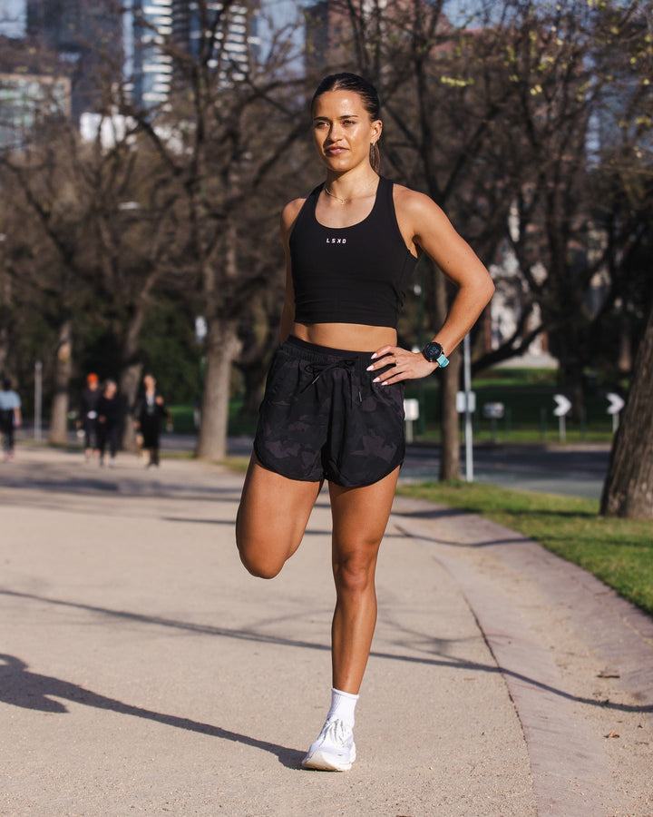 Woman wearing Dynamic Run Short - Black Camo