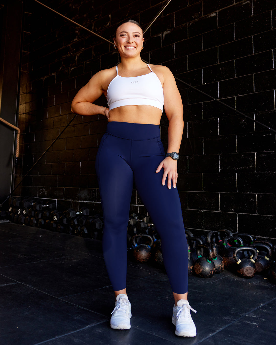 Woman wearing Elite High-Rise Full Length Legging Pockets - Midnight Blue