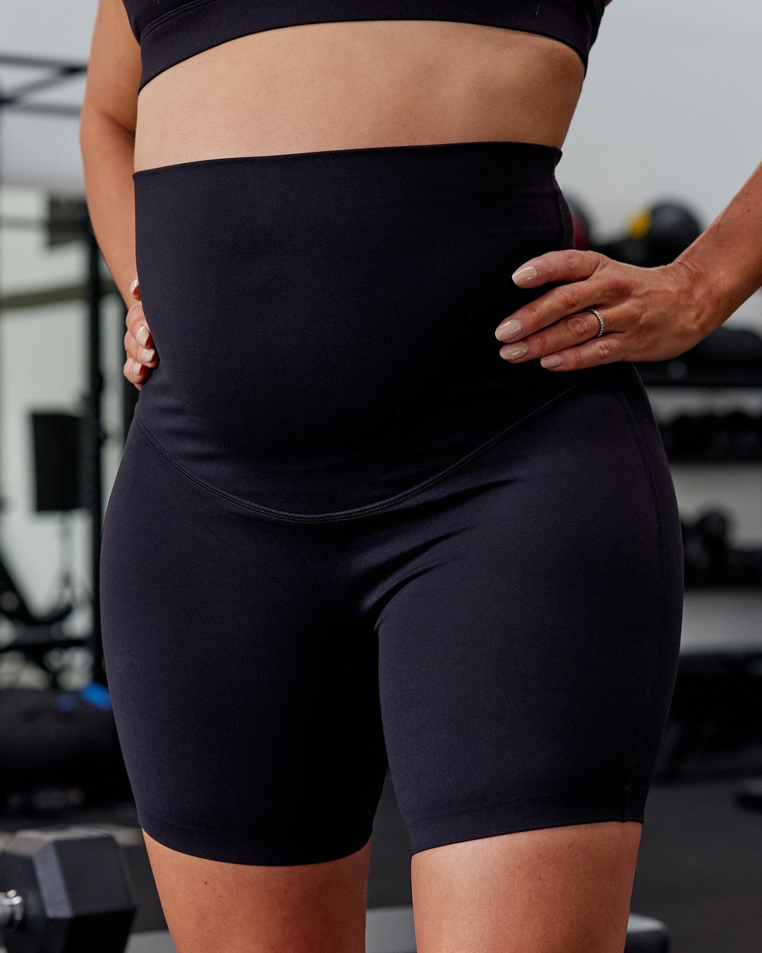Woman wearing Elixir Ultra High-Rise Maternity 6&quot; Short - Black | Model:Amanda | Size:S