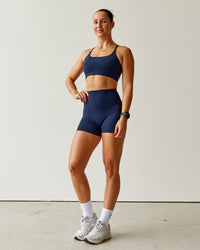 Woman wearing Elixir Ultra High-Rise 4" Short - Future Navy | Model:Abbey | Size:S
