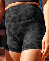 Woman wearing Elixir Ultra High-Rise 4" Short Pockets - Tranquil-Black | Size:L