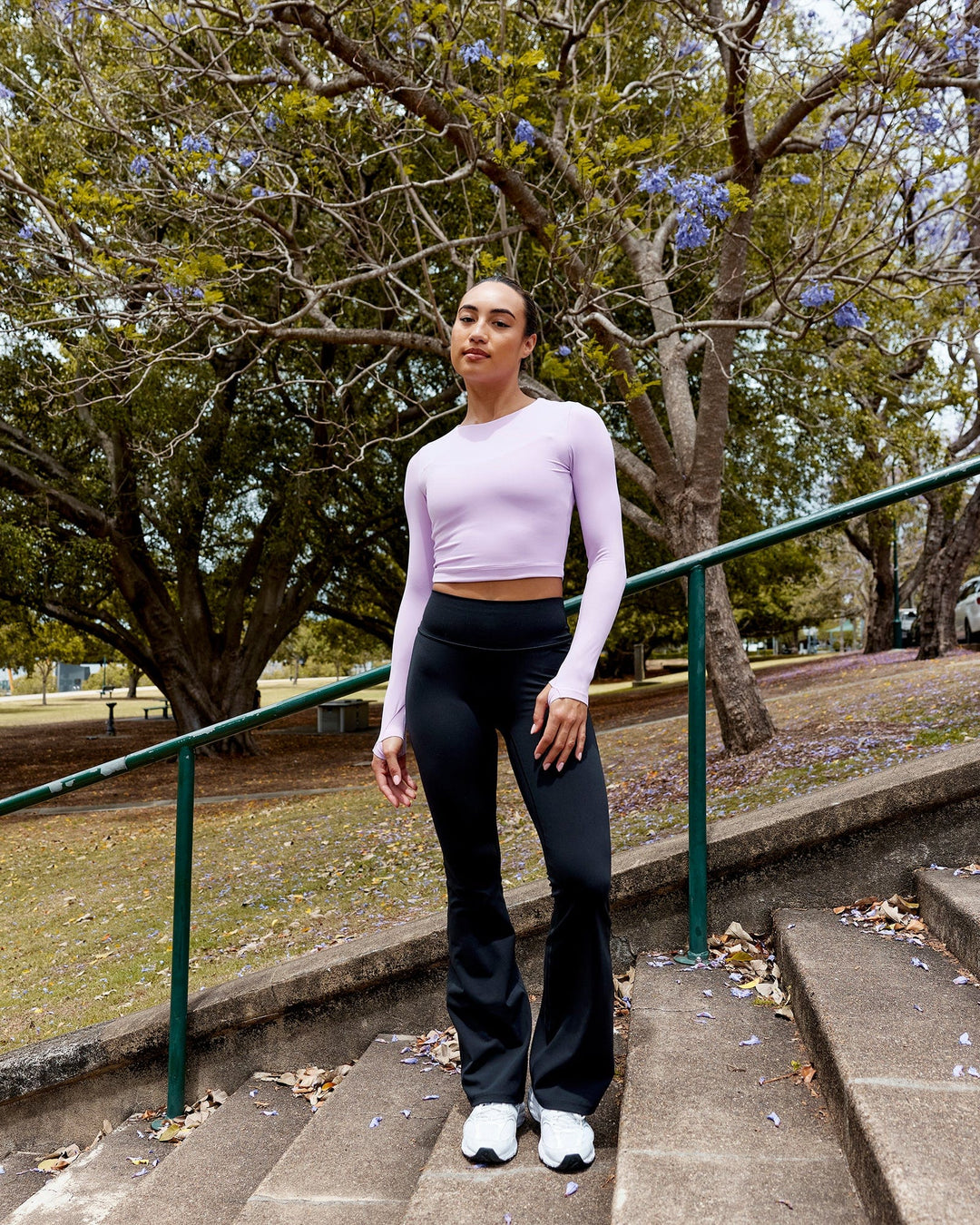 Woman wearing Fusion Ultra High-Rise Flared Legging - Black | Model:Demi | Size:S