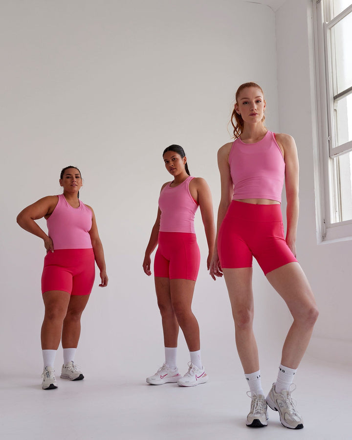 Woman wearing Flow Performance Tank - Pink Rose