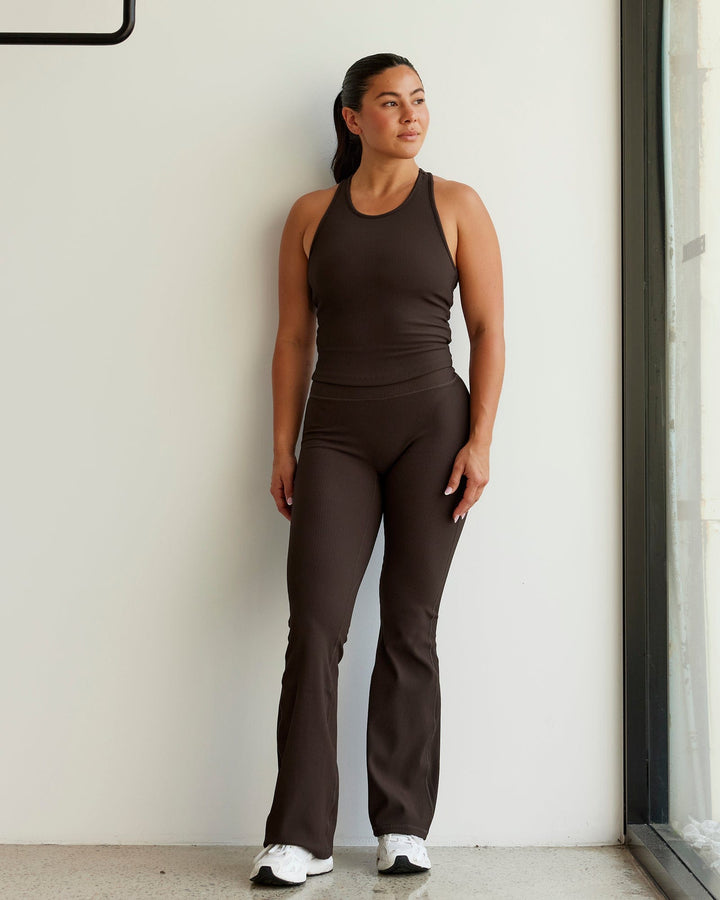Woman wearing Flow Ribbed Shelf Bra Performance Tank - Dark Chocolate