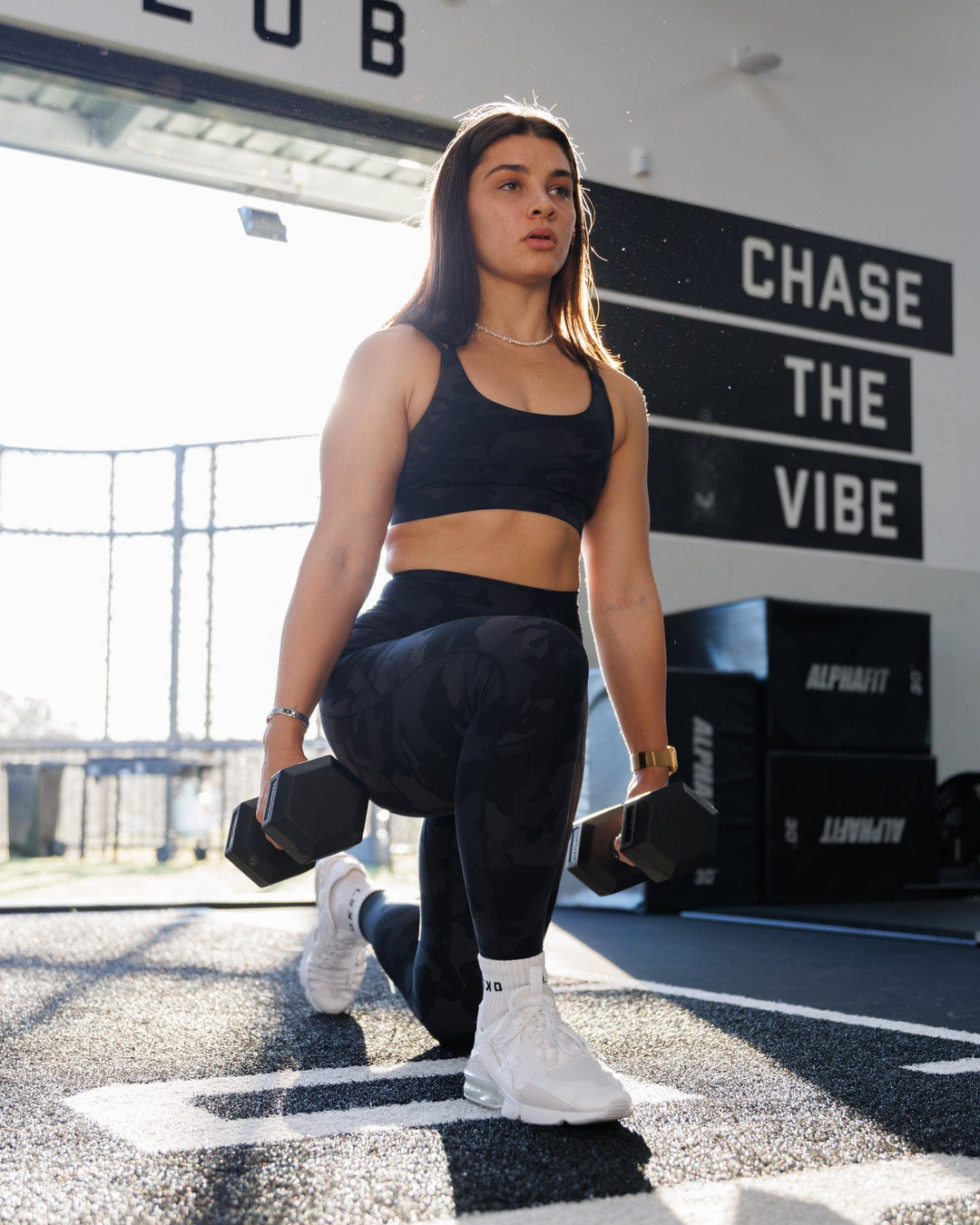 Woman wearing Fusion Ultra High-Rise Full Length Legging Pockets - Black Camo | Model:Christine | Size:S