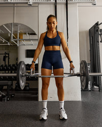 Woman wearing Fusion Ultra High-Rise 4" Short Pockets - Future Navy | Model:Tylah | Size:S