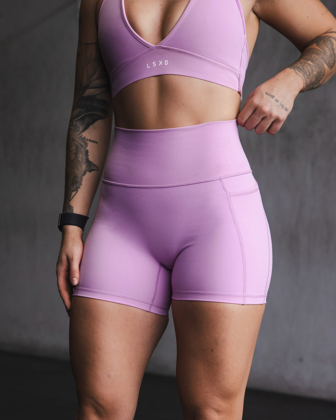 Woman wearing Fusion Ultra High-Rise 4&quot; Short Pockets - Light Violet | Model:Robyn | Size:S