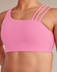 Woman wearing Galvanise Sports Bra 2.0 - Candy Pink