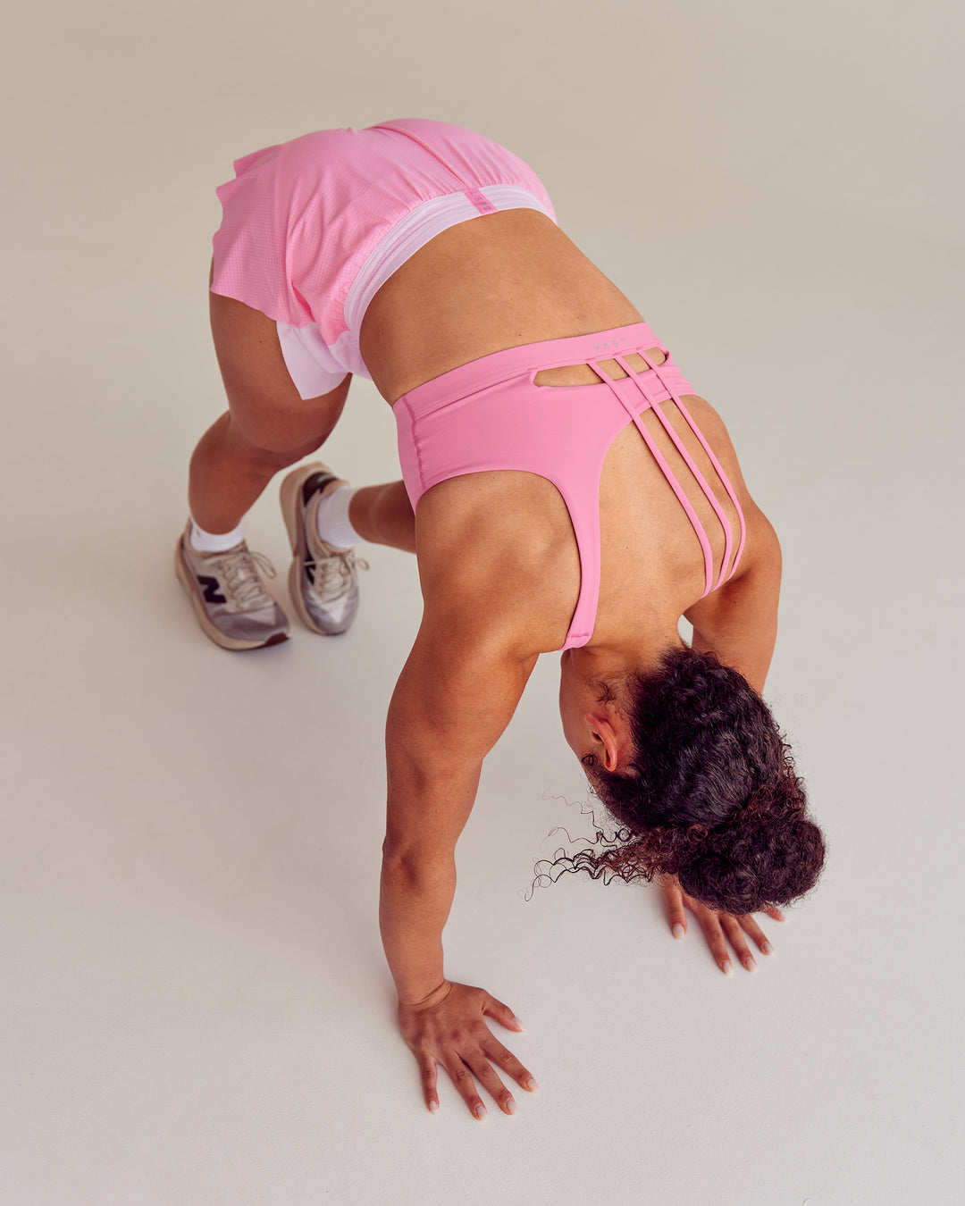 Woman wearing Galvanise Sports Bra 2.0 - Candy Pink