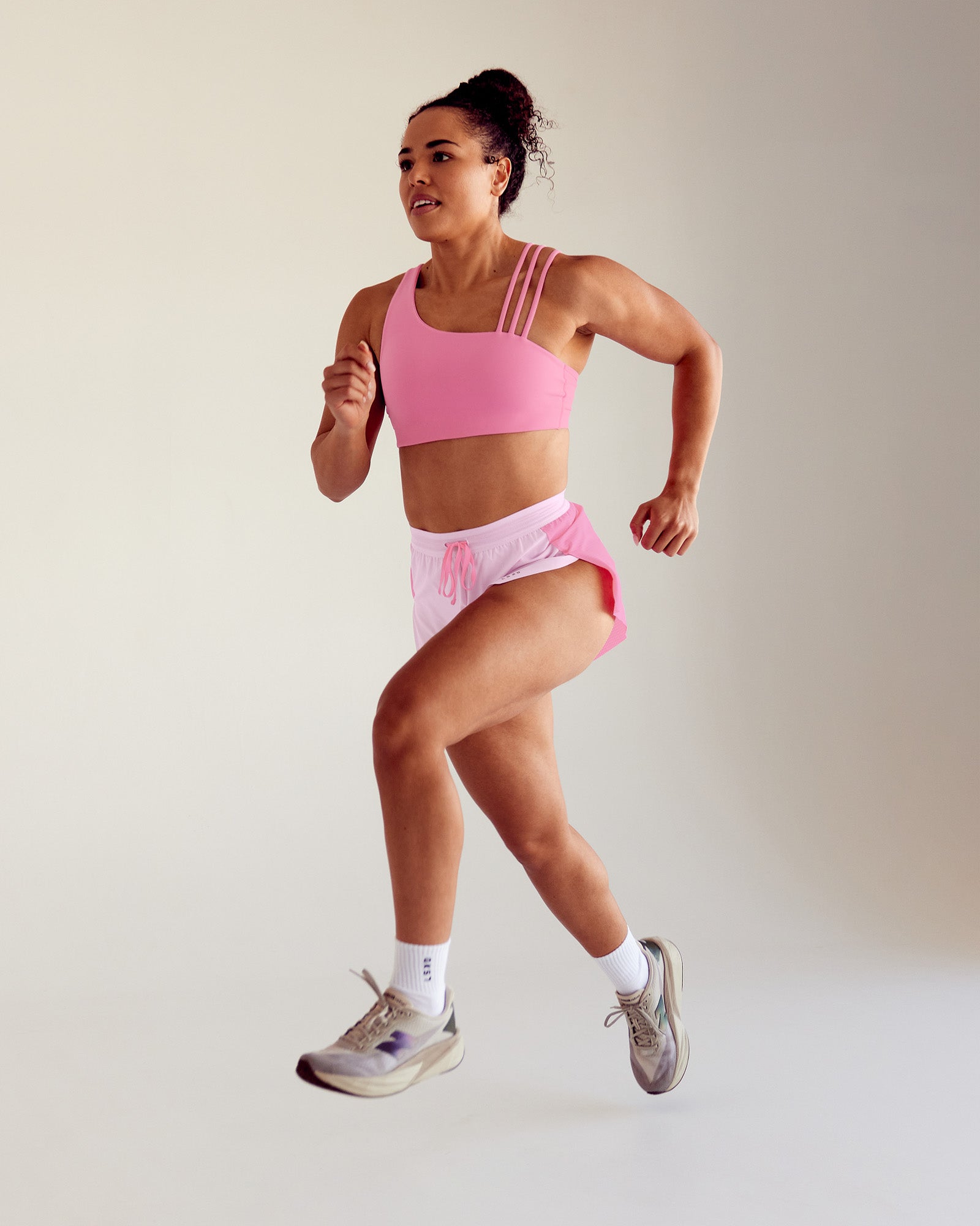 Woman wearing Galvanise Sports Bra 2.0 - Candy Pink