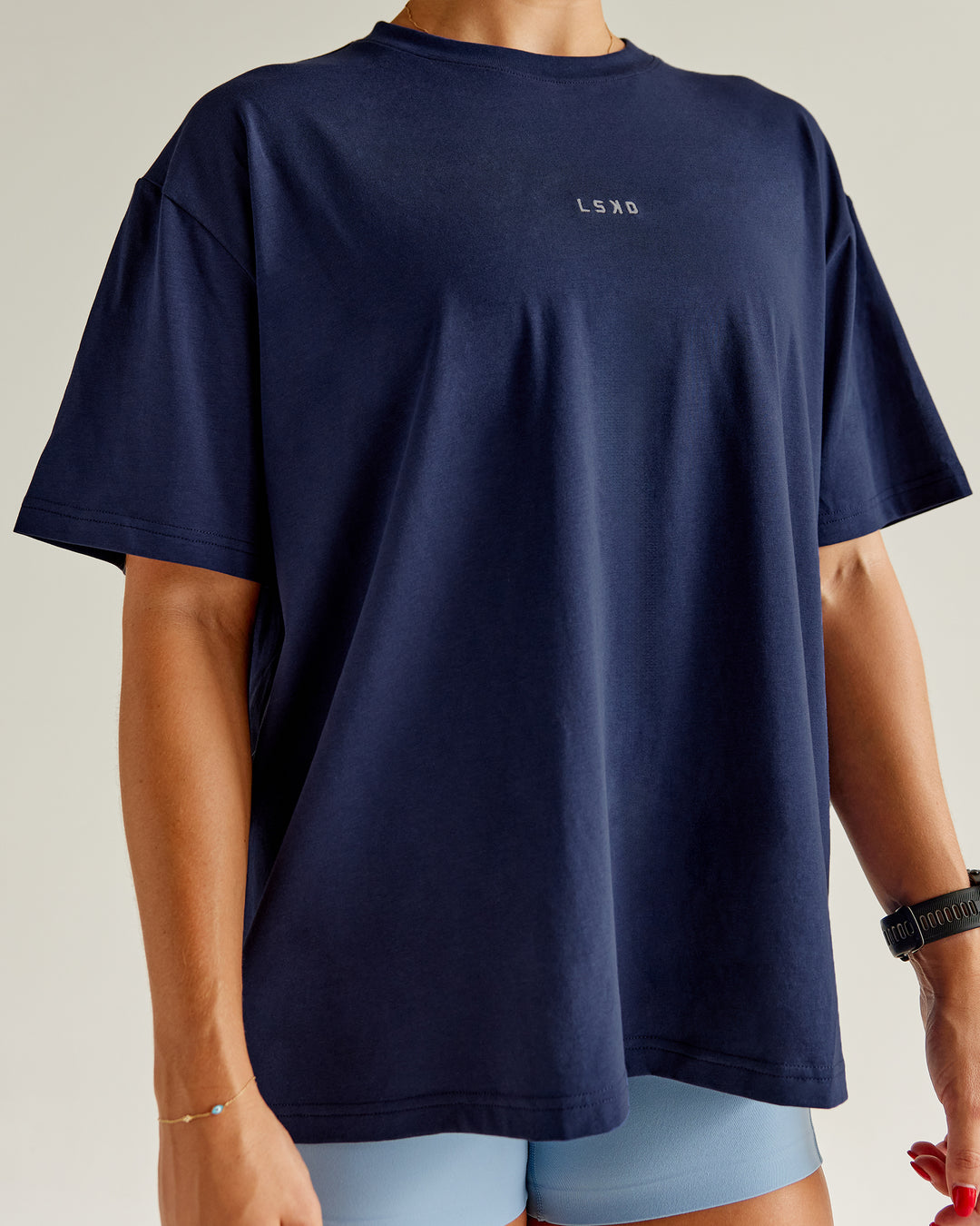 Woman wearing Go-To FLXCotton Oversized Tee - Future Navy-White | Model:Abbey | Size:S