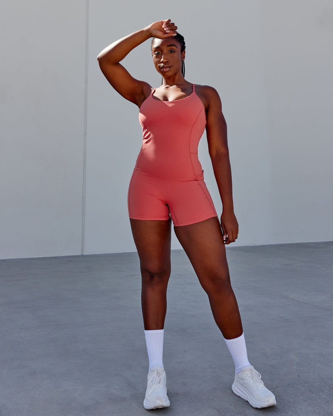Woman wearing Helix Active Bodysuit - Mineral Red
