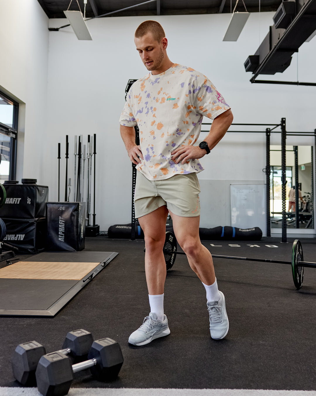 Man wearing Lift 6" Performance Shorts - Sand-So Cal 24