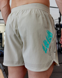 Man wearing Lift 6" Performance Shorts - Sand-So Cal 24
