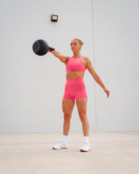 Woman wearing Lift High Neck Sports Bra - Hot Pink