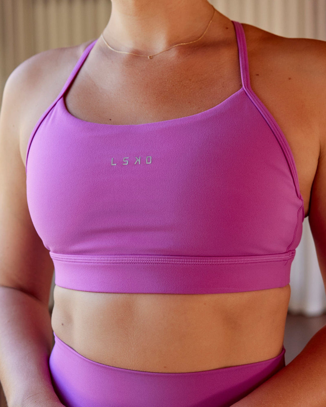 Woman wearing Lift Sports Bra - Orchid