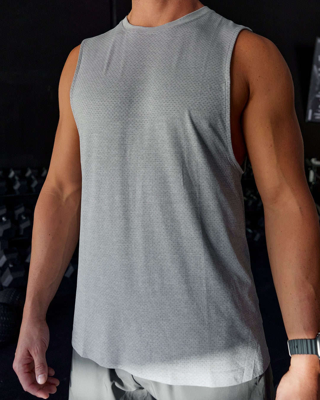 Man wearing AeroFLX+ Seamless Muscle Tank - Lt Grey Marl