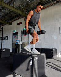 Man wearing AeroFLX+ Seamless Muscle Tank - Pirate Black Marl