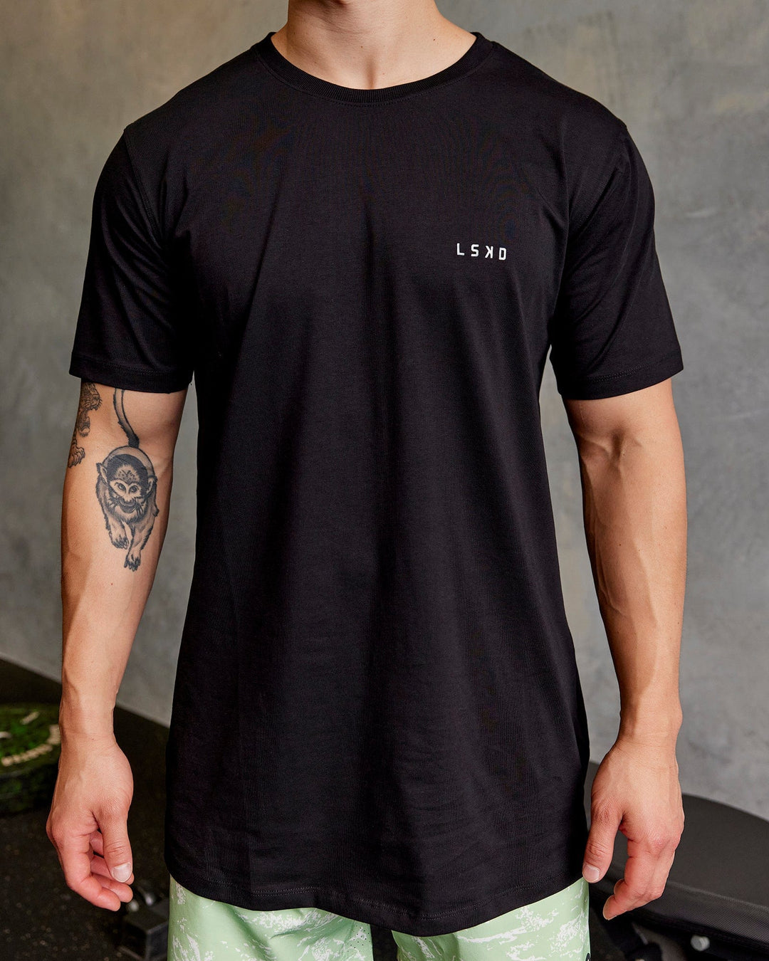 Man wearing Deluxe PimaFLX Tee - Black