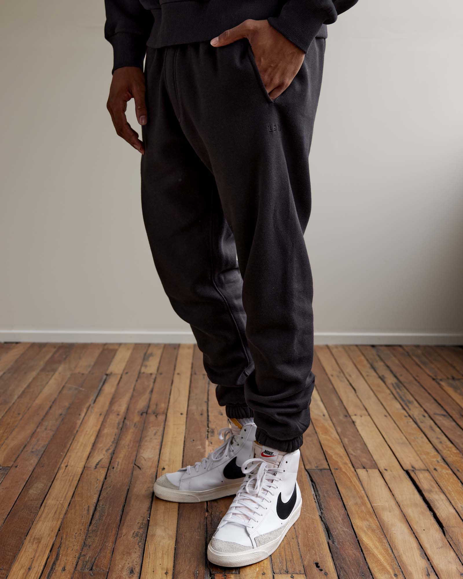 Man wearing MVP Track Pants - Black