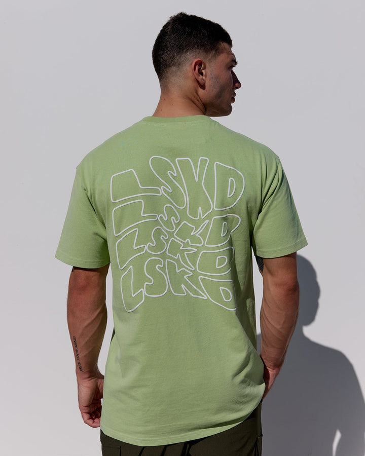 Man wearing Mad Happy Heavyweight Longline Tee Oversize - Green Fig