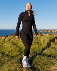 Woman wearing Motion Ultra High-Rise Thermal Full Length Legging - Black