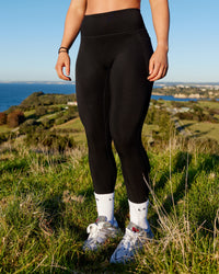 Woman wearing Motion Ultra High-Rise Thermal Full Length Legging - Black