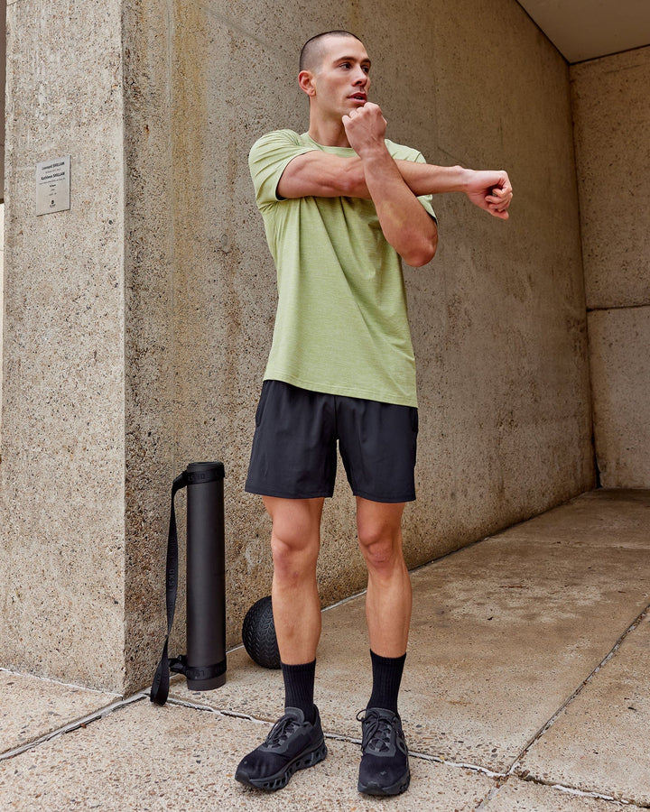 Man wearing Perform VapourFLX Tee - Moss Stone