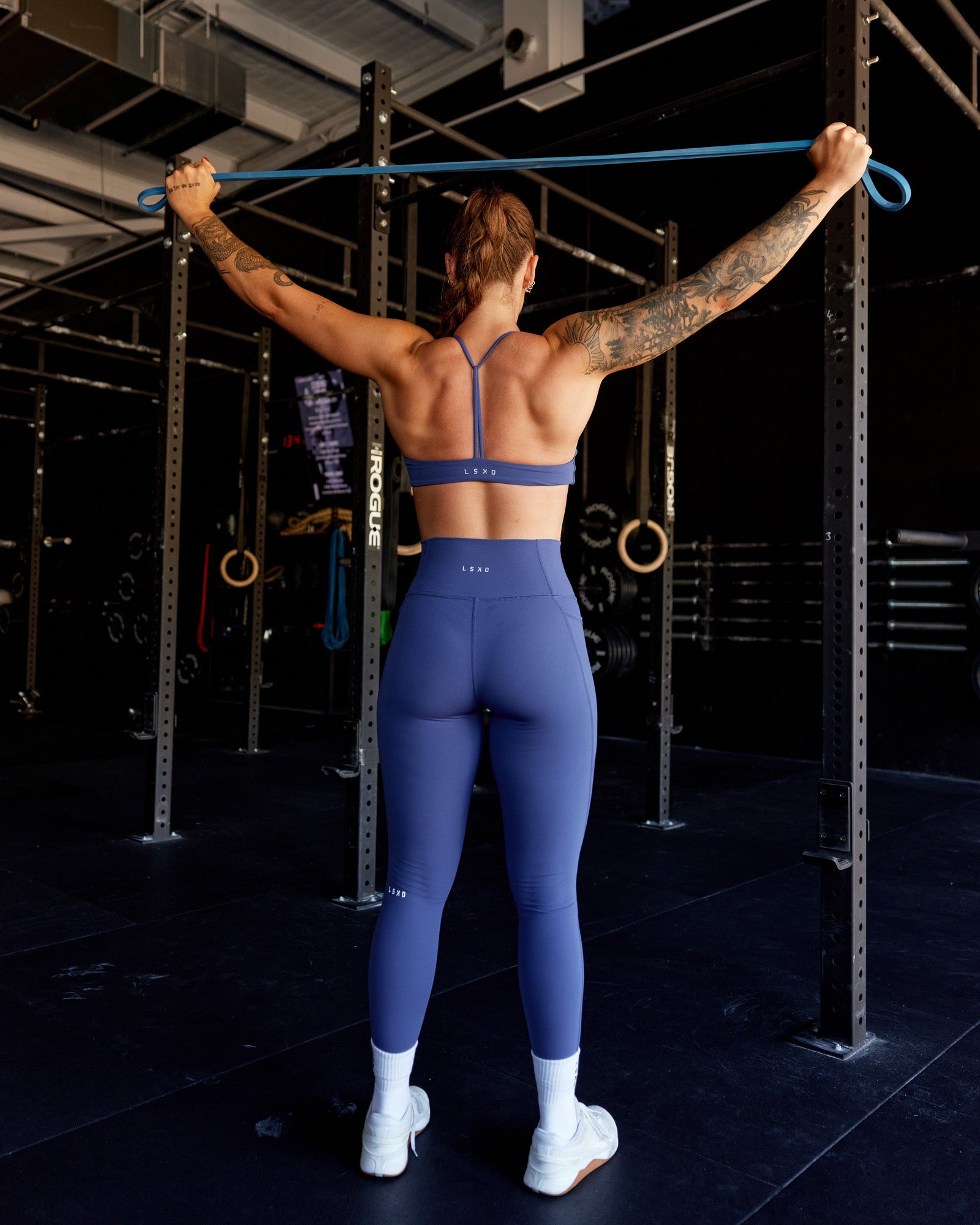 Woman wearing Progression Sports Bra - Future Dusk