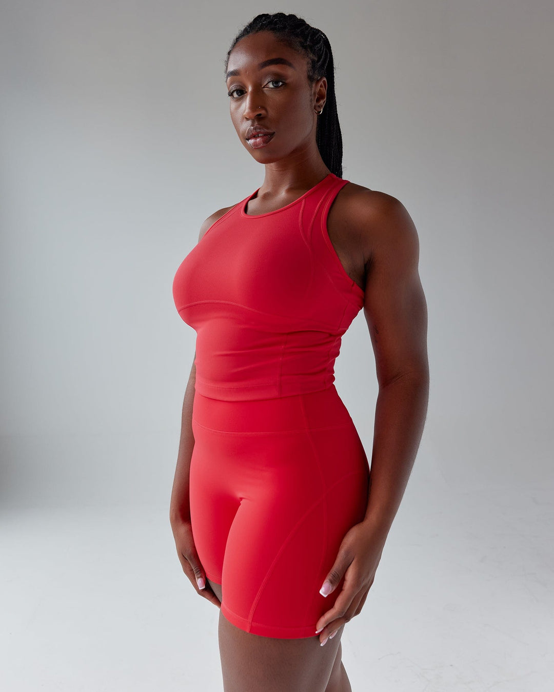 Woman wearing Propel Performance Tank - Scarlet