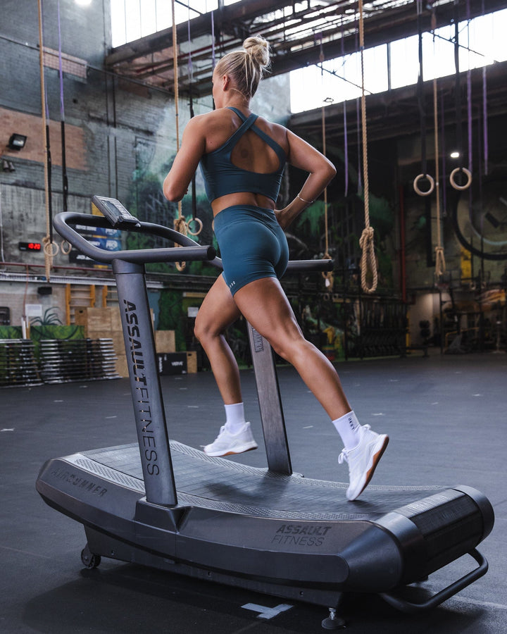 Woman wearing RXD Mid Short Tight - Tidal Teal