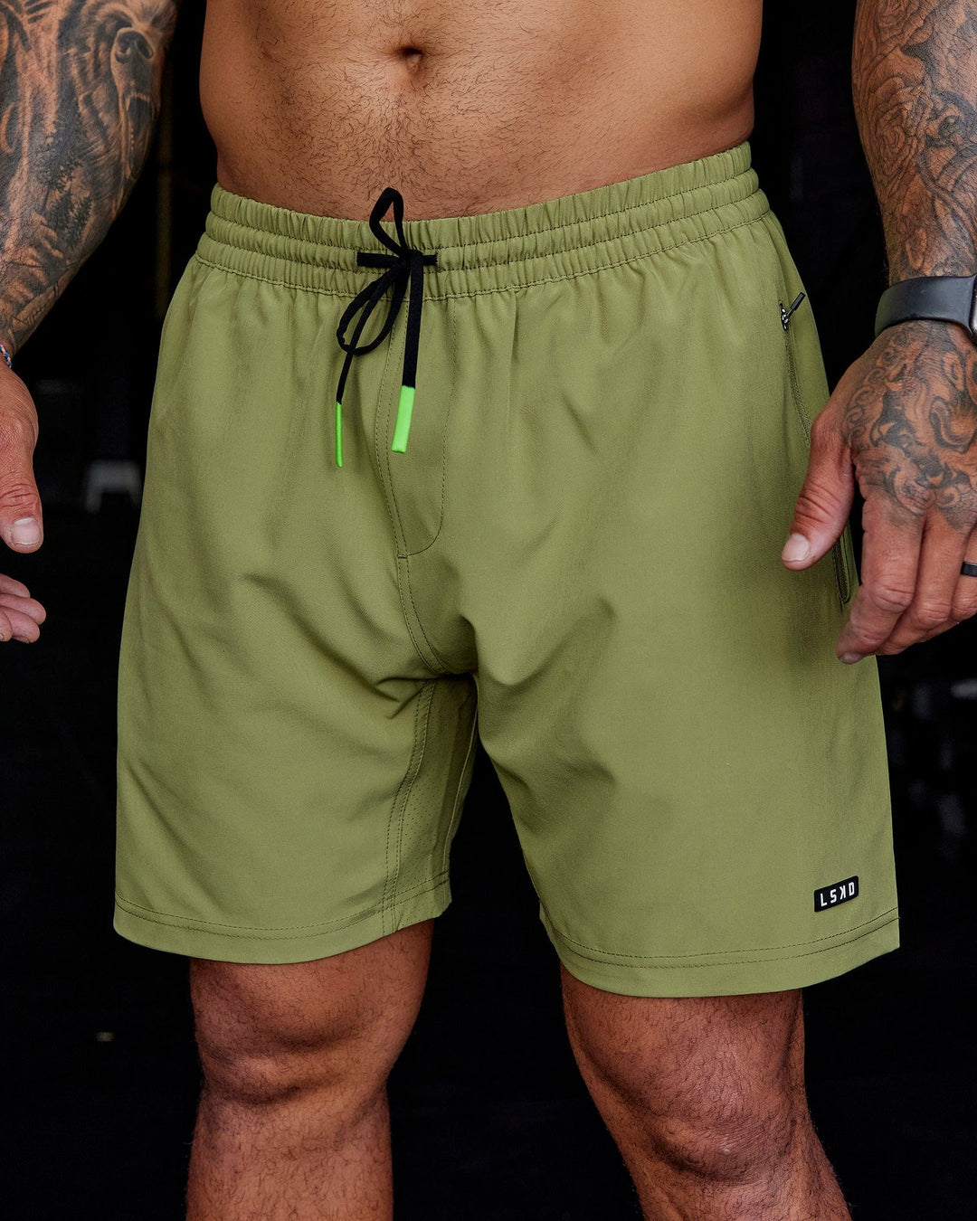 Man wearing Rep 7'' Performance Short - Moss Stone-Lime
