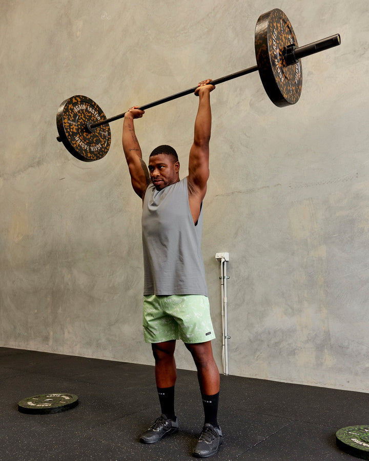 Man wearing Rep 7'' Performance Short - Terrain Green Fig