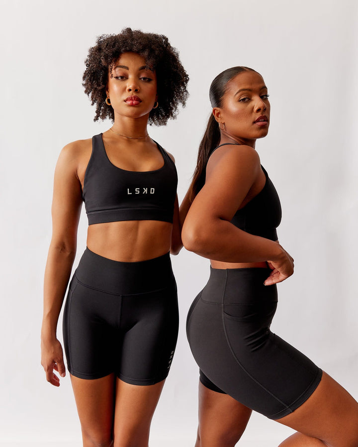 Woman wearing Rep Mid Short Tight Small Logo - Black
