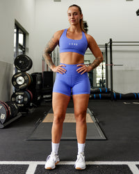 Woman wearing Rep Ultra High-Rise 4" Short Pockets - Baja Blue-White | Model:Robyn | Size:S