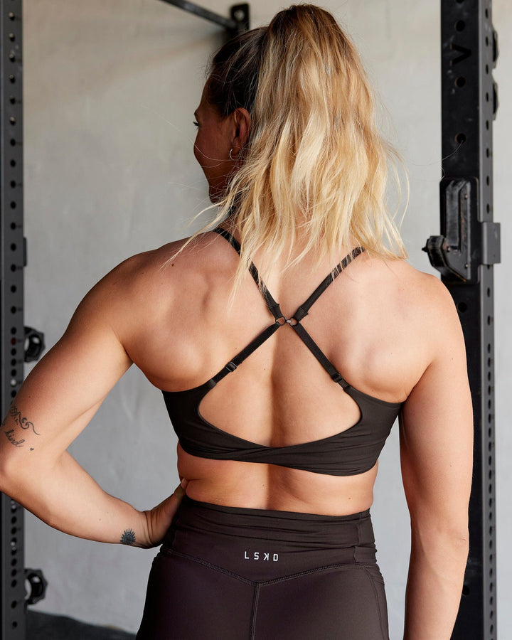 Woman wearing Twist Sports Bra - Dark Walnut