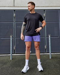 Man wearing UltraAir 5" Lined Performance Shorts - Dahlia Purple
