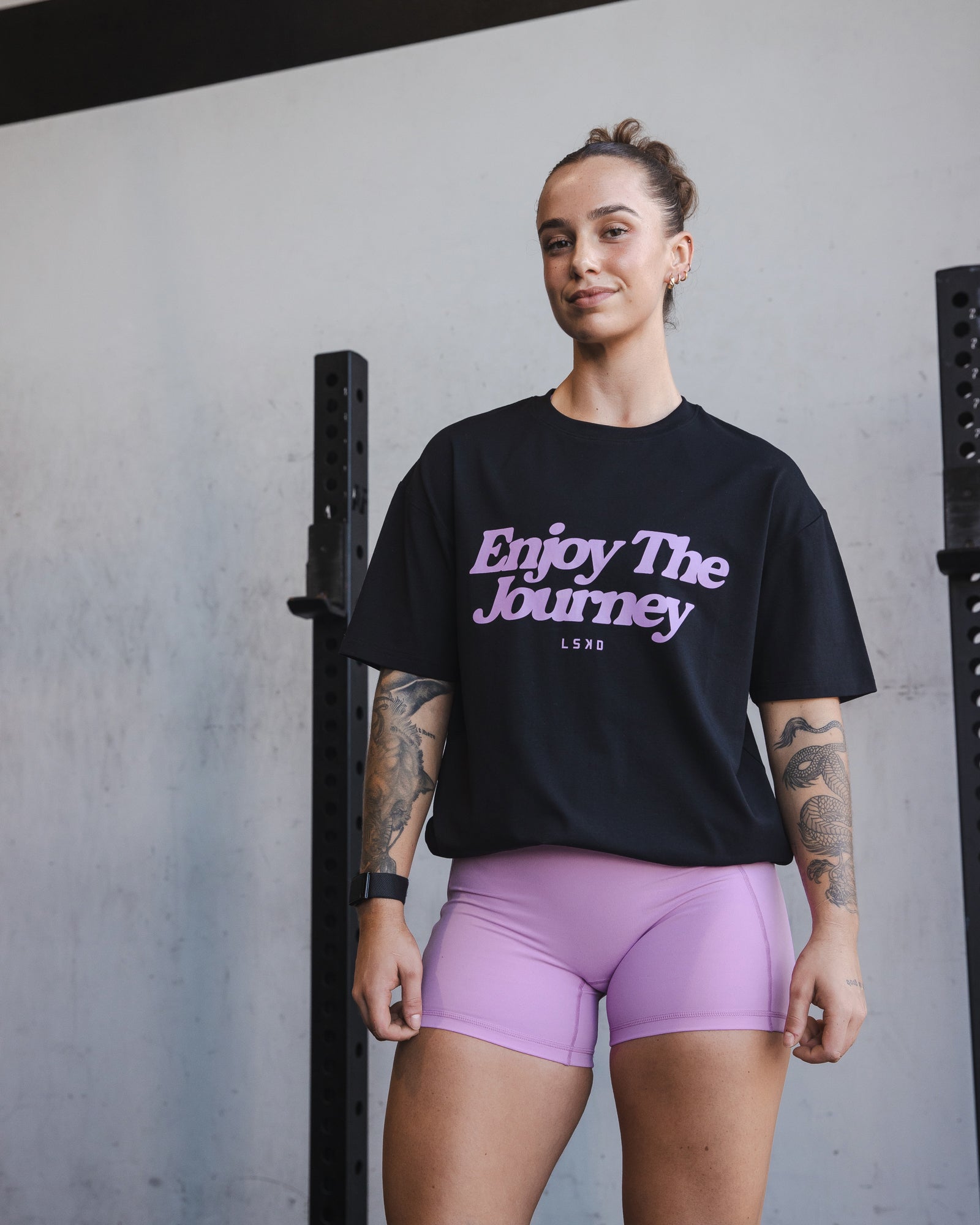 Woman wearing Unisex Enjoy The Journey FLXCotton Tee Oversize - Black-Light Violet