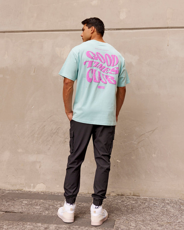Man wearing Unisex Good Times Heavyweight Tee Oversize - Pastel Turquoise-Spark Pink